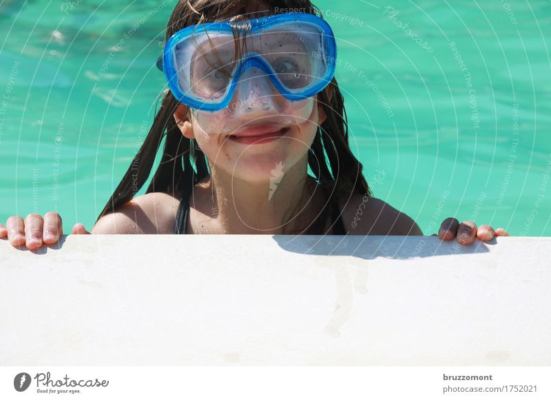 Girl with diving goggles in swimming pool Human being Feminine Child Infancy Face 1 8 - 13 years Water Swimming & Bathing Relaxation Dive Blue Green Emotions