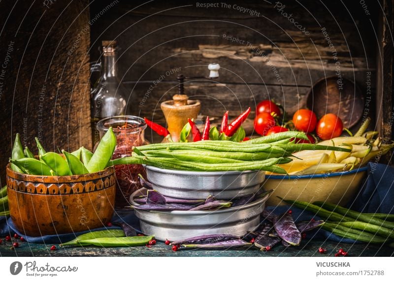 Colourful peas and beans on a rustic kitchen table Food Vegetable Herbs and spices Cooking oil Nutrition Organic produce Vegetarian diet Diet Crockery Bowl