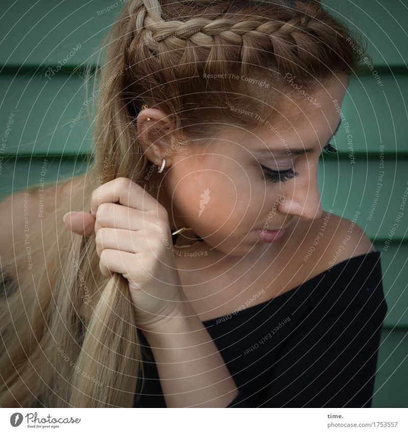 . Feminine 1 Human being Wall (barrier) Wall (building) Shirt Jewellery Piercing Earring Hair and hairstyles Blonde Long-haired Observe Think To hold on Looking