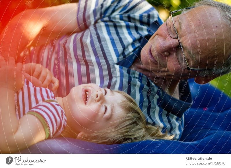 grandpa and grandchildren laughing on an air mattress Human being Masculine Child Toddler Boy (child) Man Adults Male senior Grandfather Family & Relations 2