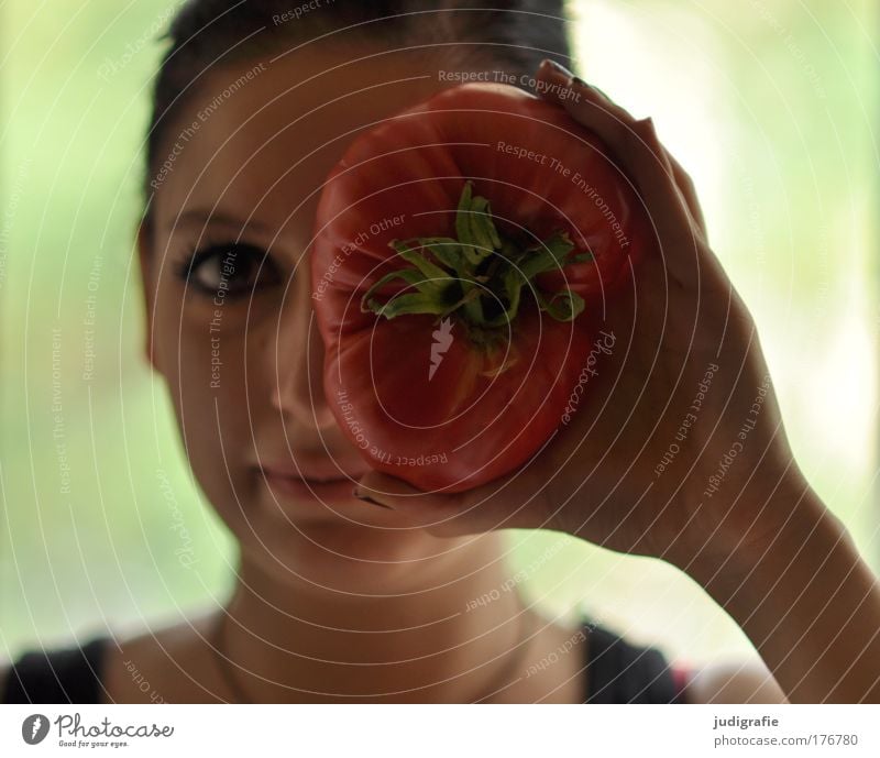 Girl with tomato Colour photo Day Blur Looking Food Vegetable Organic produce Vegetarian diet Human being Feminine Young woman Youth (Young adults) 1