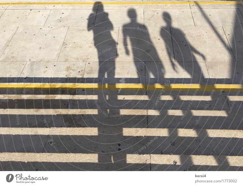 standing and walking shadows - a Royalty Free Stock Photo from Photocase