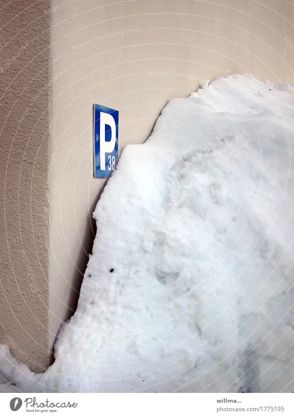 Towing service call ... Winter Snow Wall (barrier) Wall (building) Parking lot Parking space number Parking sign Cold Pile of snow Colour photo Exterior shot