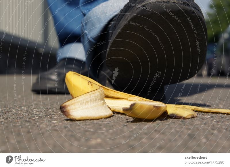 person about to slip on a banana peel Fruit Human being Man Adults Feet 1 Pedestrian Street Footwear Dangerous Banana Slapstick Ground Skid Slippery surface