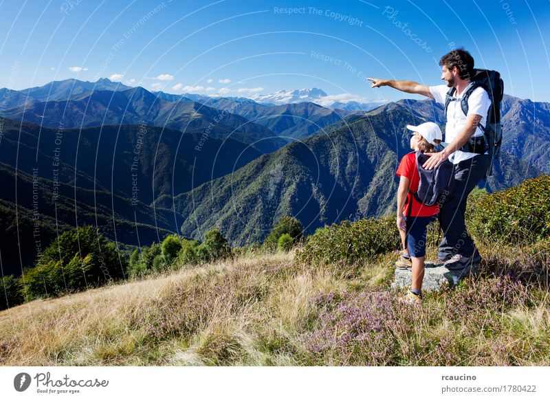Man and young boy standing in a mountain meadow. Lifestyle Relaxation Vacation & Travel Tourism Summer Mountain Hiking Sports Child Human being Boy (child)