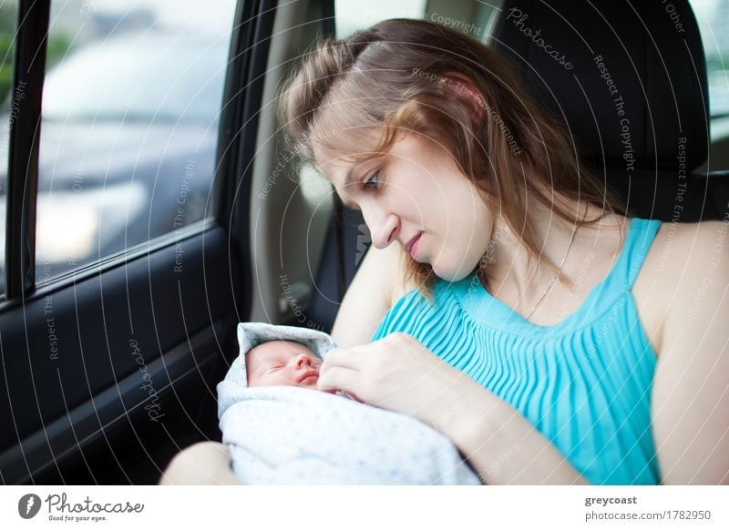 Mother looks gently at infant while travelling in the car Happy Face Life Vacation & Travel Trip Child Human being Baby Woman Adults Family & Relations Infancy