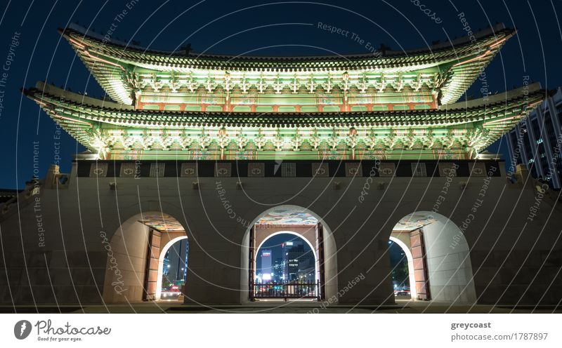 Low angle night shot of the illuminated Gwanghwamun Gate. Landmarks of Seoul in South Korea Vacation & Travel Tourism Sightseeing Town Palace Architecture
