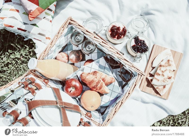 Happy Picnic Basket And Delicious Food In Spring Fruit Apple Orange Croissant Jam Nutrition Eating Breakfast Lunch Juice Crockery Bottle Cutlery Relaxation