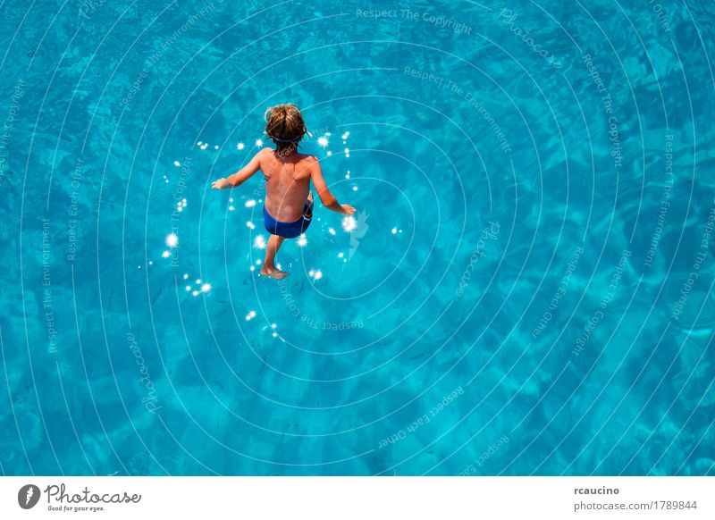 Boy jumping into the sea Joy Relaxation Vacation & Travel Tourism Summer Ocean Child Boy (child) Man Adults Jump Blue Turquoise clear Crisp Horizontal mid-air