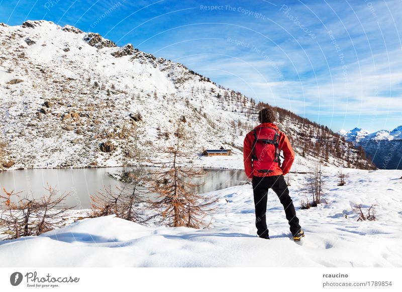 Hiker Winter Mountain Lake Relaxation Vacation & Travel Tourism Adventure Expedition Snow Sports Human being Boy (child) Man Adults Nature Landscape Sky Tree
