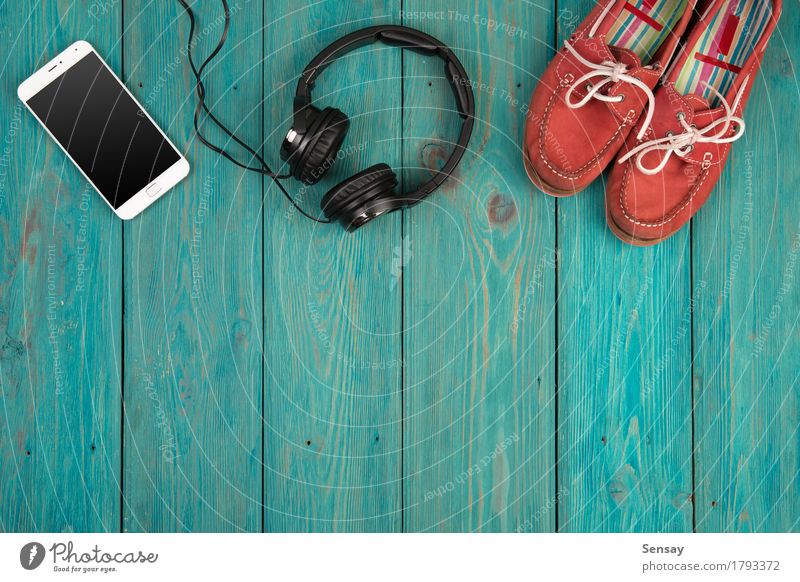 music concept - smartphone and headphones Table Business Telephone PDA Computer Screen Technology Internet Media Heart Listening Love Above Smart Yellow White