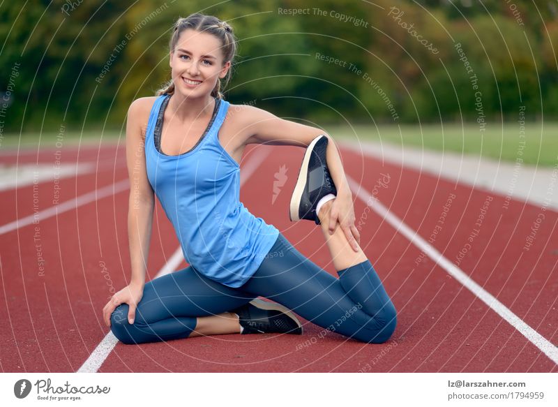 Happy fit young woman doing stretching exercises Lifestyle Beautiful Face Summer Sports Yoga Feminine Woman Adults 1 Human being 18 - 30 years