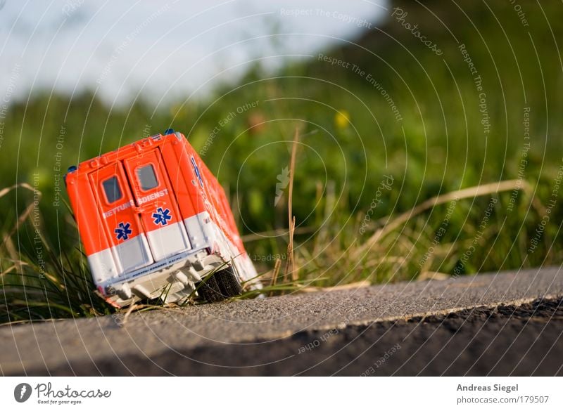 rescuer in distress Colour photo Exterior shot Deserted Day Sunlight Blur Leisure and hobbies Playing Model-making Toys Toy car Garden Meadow Traffic accident