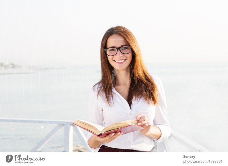 Young female student in reading glasses Happy Beautiful Face Relaxation Reading Summer Beach Ocean Business Human being Girl Woman Adults Street Fashion Smiling