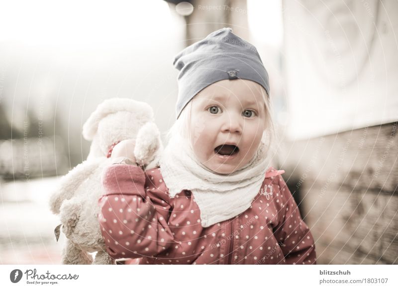 not scared, not happy ;) Human being Feminine Toddler Girl Head 1 - 3 years Scarf Cap Blonde Emotions Defiant Exterior shot Blur Long shot
