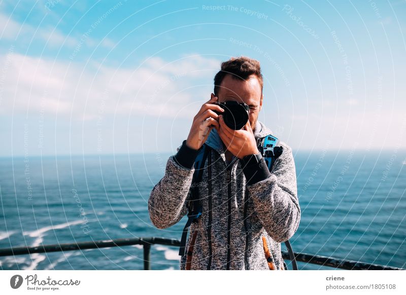Man taking photo with vintage camera on holiday Lifestyle Leisure and hobbies Vacation & Travel Summer Beach Ocean Waves Camera Technology Human being Young man