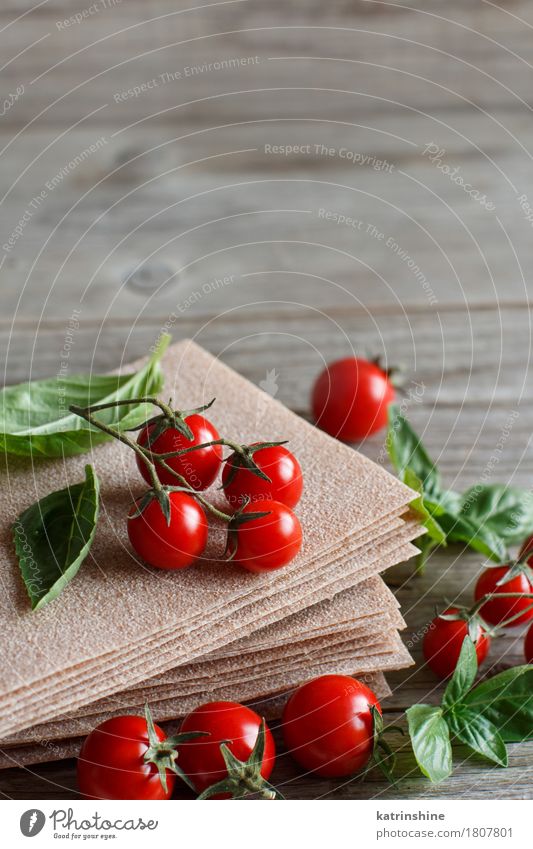 Raw lasagna sheets,basil and cherry tomatoes Vegetable Dough Baked goods Nutrition Italian Food Design Table Restaurant Old Green Red Tradition background
