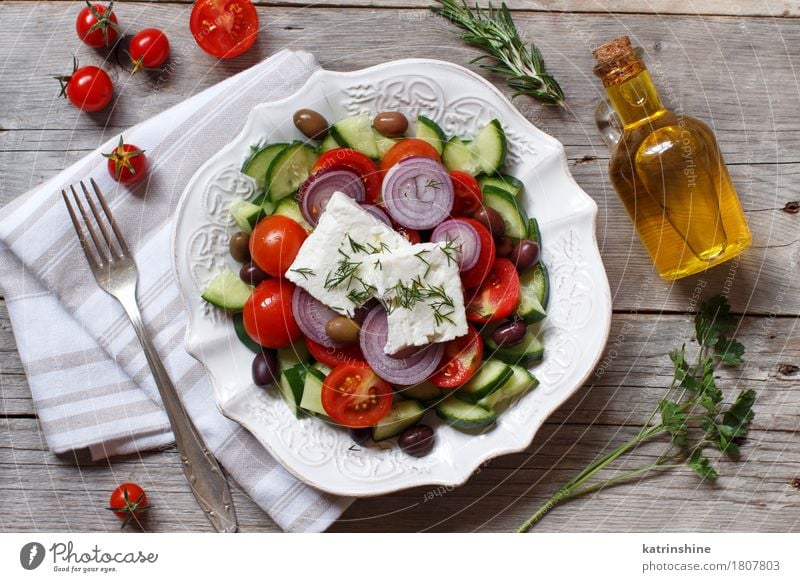 Greek salad Food Cheese Vegetable Eating Lunch Dinner Vegetarian diet Plate Bottle Table Wood Fresh Gray Green Red Tomato chery tomatoes Feta cheese Cucumber