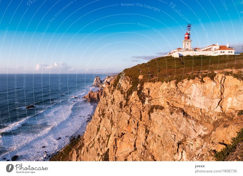 Cabo da Roca Landscape Beautiful weather Rock Waves Ocean Portugal Lighthouse Retro Blue Brown Green Red White Safety Loneliness Horizon Target Colour photo