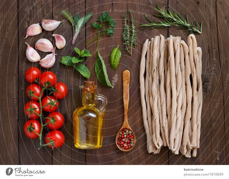 Whole wheat pasta, vegetables, herbs and olive oil Vegetable Dough Baked goods Herbs and spices Cooking oil Vegetarian diet Diet Italian Food Bottle Spoon Table