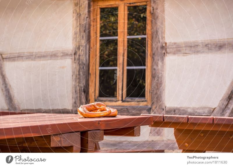 Pretzel on table in a rustic German decor Bread Breakfast Design House (Residential Structure) Table Culture Architecture Facade Diet Feeding Delicious Brown