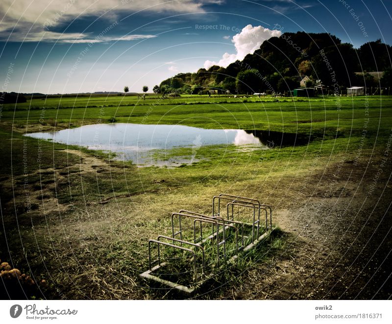 Landscape with bicycle stand Environment Nature Plant Water Sky Clouds Horizon Climate Beautiful weather Tree Grass Meadow Hill Baltic Sea Puddle Rügen Village
