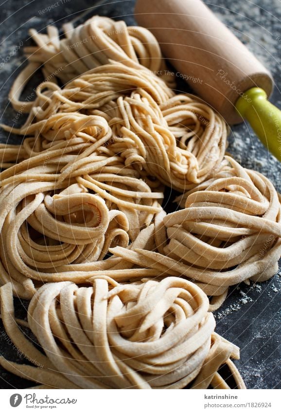Fresh homemade pasta and rolling pin Dough Baked goods Vegetarian diet Italian Food Dark Yellow Carbohydrate Cooking Flour Healthy Home-made Ingredients Meal