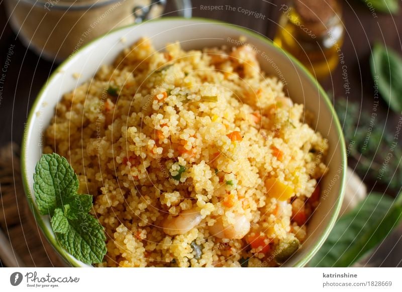 Couscous with shrimps and vegetables in a bowl Seafood Vegetable Herbs and spices Cooking oil Lunch Dinner Bowl Brown Yellow Tradition Africa african Algerian