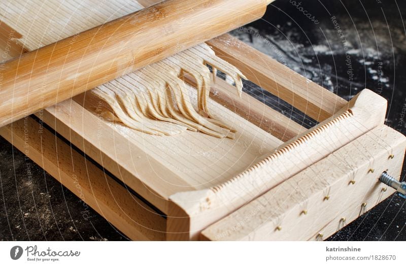 Making spaghetti alla chitarra with a tool Dough Baked goods Nutrition Italian Food Table Kitchen Make Dark Fresh Tradition Ingredients manual mediterranean