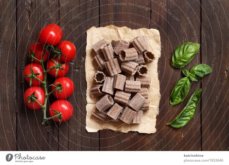 Raw italian pasta, basil and cherry tomatoes Vegetable Dough Baked goods Herbs and spices Nutrition Vegetarian diet Diet Italian Food Table Leaf Dark Fresh