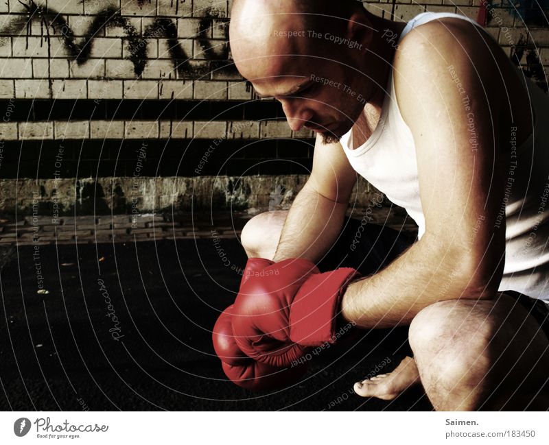 Hit Colour photo Subdued colour Exterior shot Copy Space left Day Shadow Central perspective Downward Sports Martial arts Sportsperson Loser Boxing Masculine