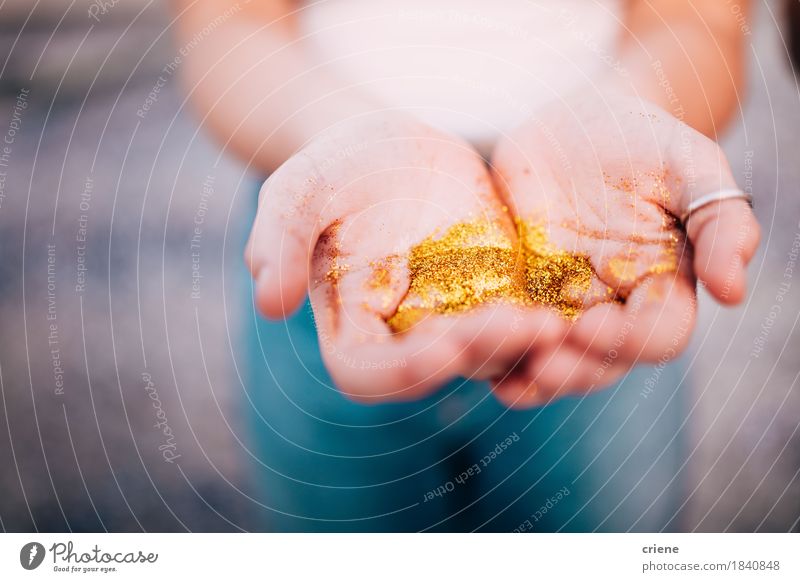 Close-up of Hands holding golden glitter Lifestyle Decoration Young woman Youth (Young adults) Woman Adults Fingers Art Hip & trendy Beautiful Natural Gold