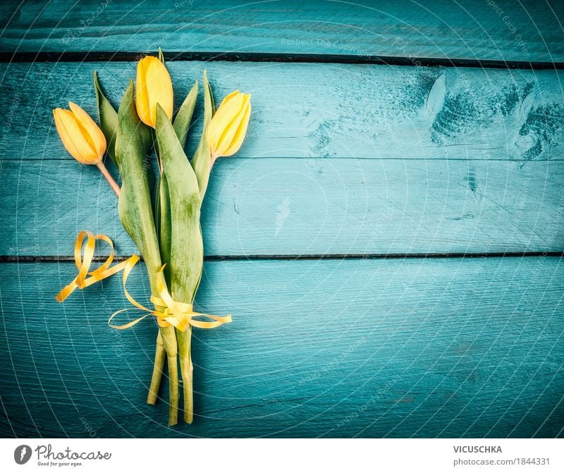 Yellow tulips bouquet on turquoise background Style Design Decoration Feasts & Celebrations Valentine's Day Mother's Day Birthday Nature Plant Flower Tulip Leaf