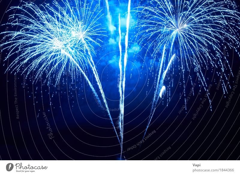 Blue colorful fireworks Joy Night life Entertainment Party Event Feasts & Celebrations Christmas & Advent New Year's Eve Art Sky Night sky Dark Bright Black