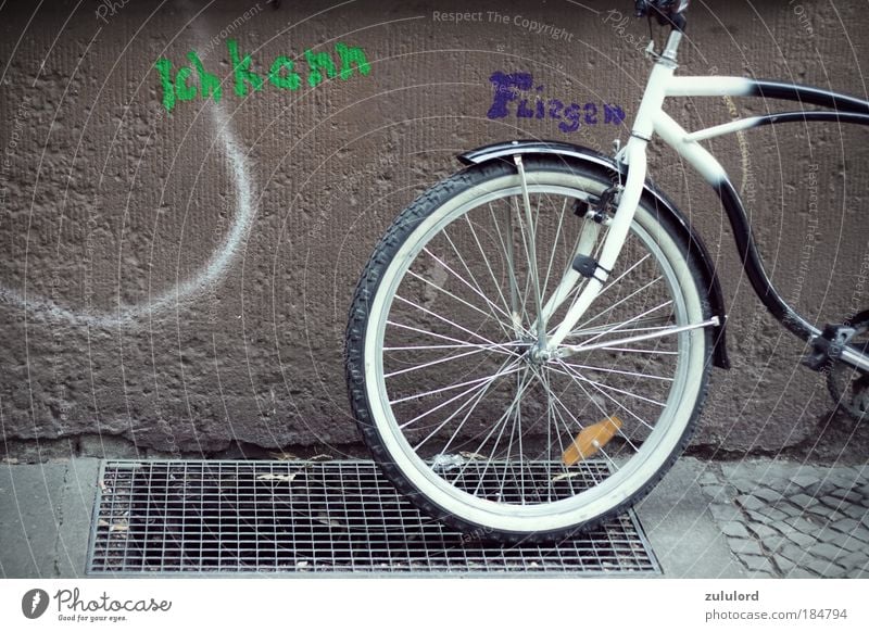 I can fly Colour photo Exterior shot Day Lifestyle Bicycle Driving Flying Vacation & Travel Infinity Friedrichshain Symbols and metaphors Facade Graffiti Art