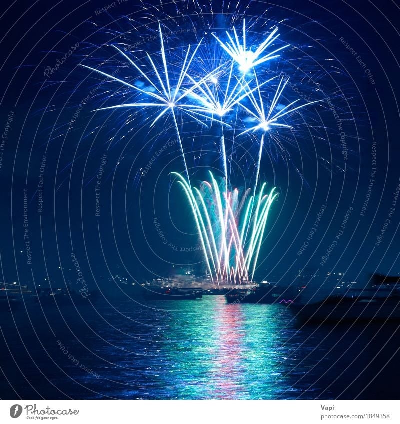 Colorful fireworks above a lake Joy Freedom Night life Entertainment Party Event Feasts & Celebrations Christmas & Advent New Year's Eve Art Sky Night sky Dark