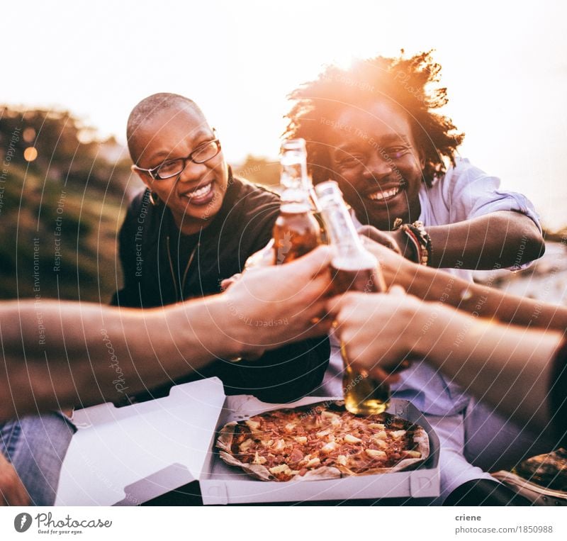 Multi Ethnic Group of friends enjoying drinks and pizza Food Eating Lunch Dinner Beverage Drinking Cold drink Alcoholic drinks Beer Bottle Lifestyle Joy