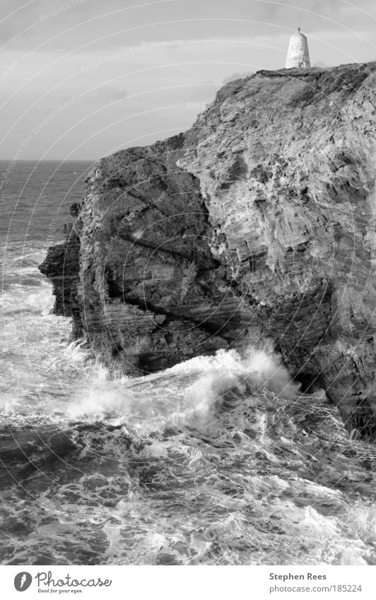 Cliffs and the Pepperpot Daymark in Portreath Ocean Waves Sky Clouds Coast Stone Old Black White Atlantic Ocean British Monochrome rock layers Erosion Rough