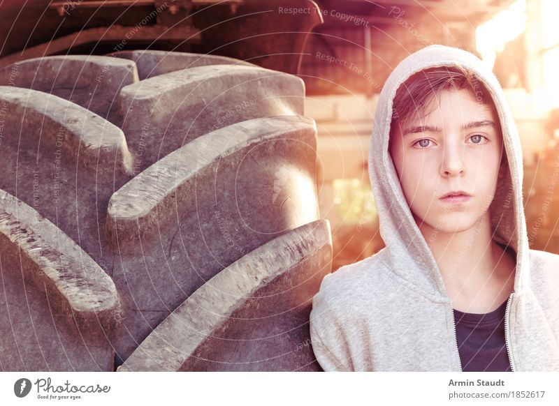 Portrait with tractor tyres Lifestyle Style Beautiful Human being Masculine Youth (Young adults) 1 13 - 18 years Summer Fashion Hooded sweater Hooded jacket