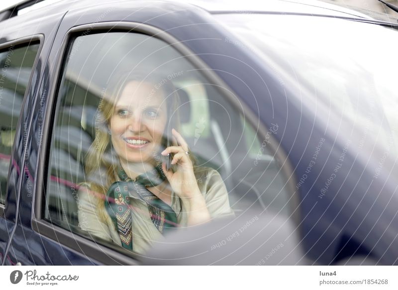 busy Business To talk Telephone Cellphone PDA Technology Feminine Woman Adults 1 Human being 30 - 45 years Motoring Vehicle Car Blonde Laughter
