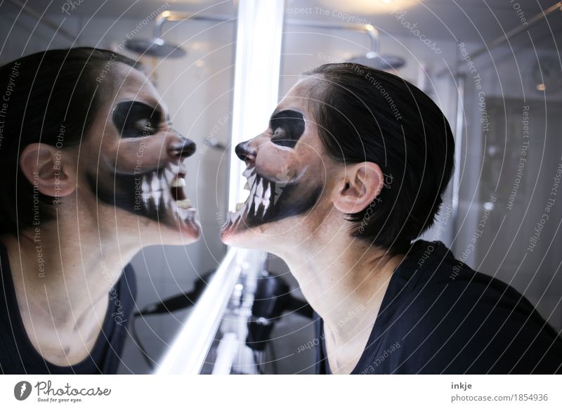 show teeth Lifestyle Leisure and hobbies Mirror Bathroom Carnival Hallowe'en Woman Adults Face 1 Human being Stage make-up Death's head Grimace Mask Scream