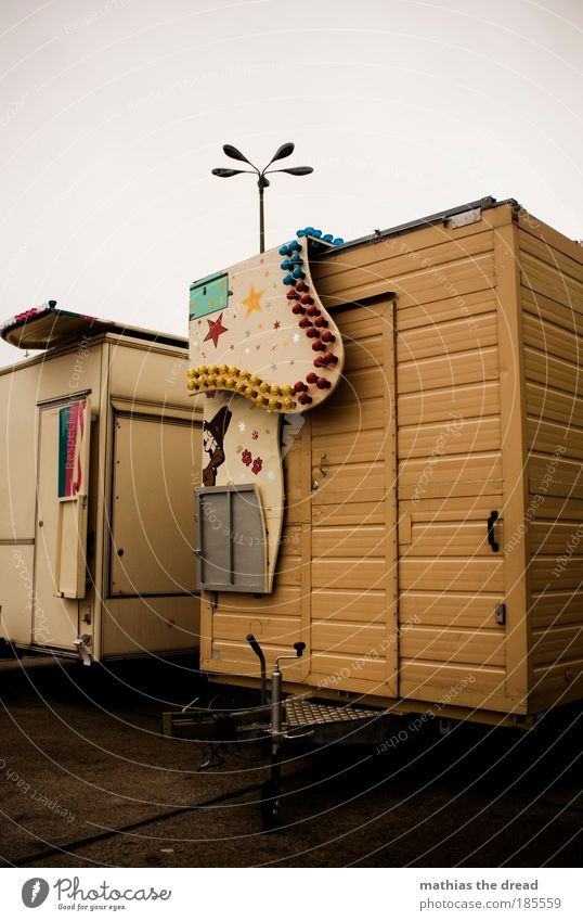 THE CARNIVAL IS OVER. Sky Clouds Bad weather Deserted Road traffic Street Vehicle Mobile home Caravan Old Gloomy Badlands Camping Stalls and stands
