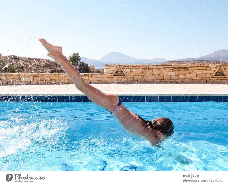 Young girl takes a header into swimming pool Summer Swimming pool Swimming & Bathing Headfirst dive Feminine Child Body 1 Human being 8 - 13 years Infancy Water