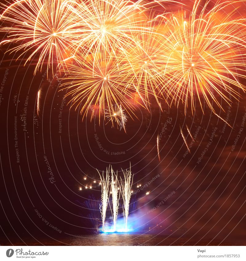 Red colorful fireworks Joy Freedom Waves Night life Entertainment Party Event Feasts & Celebrations Christmas & Advent New Year's Eve Art Shows Water Sky