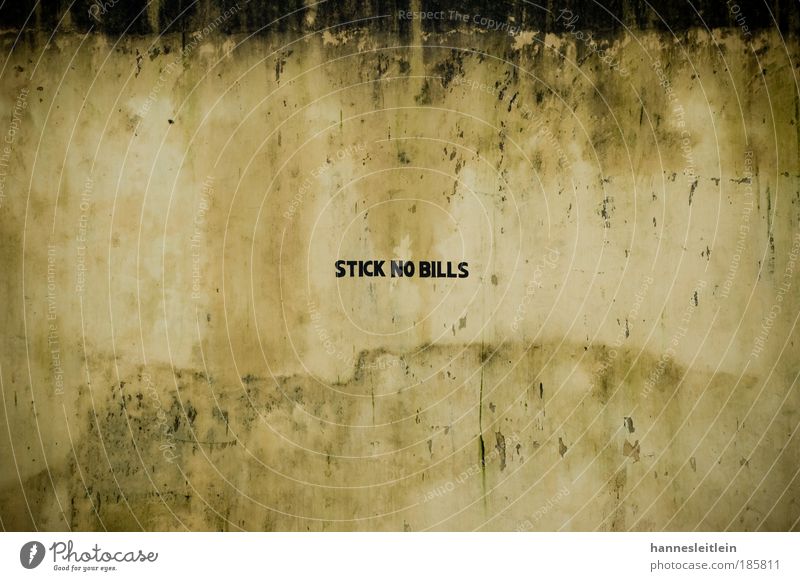 stick no bills Art Subculture Deserted Wall (barrier) Wall (building) Monument Concrete Characters Signs and labeling Make Cleaning Trashy Brown Yellow Black