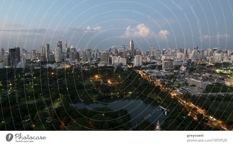 Evening Bangkok, Thailand. Panorama with modern highrise buildings, green park and transport traffic on long highway Nature Sky Clouds Park Forest Town Building