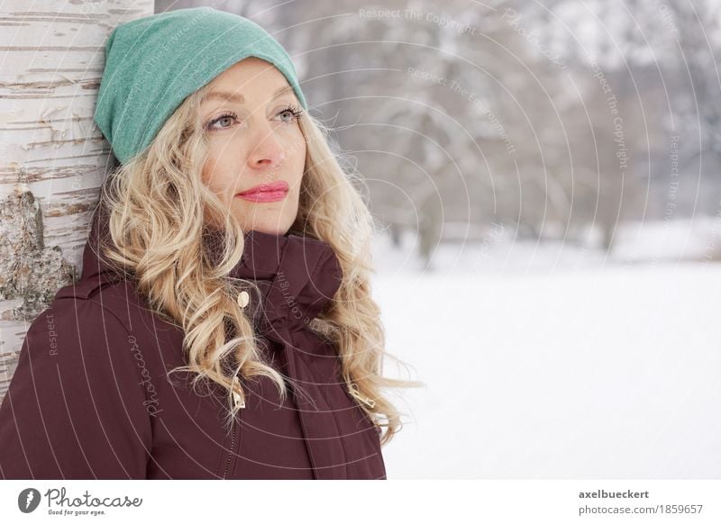 woman leaning against tree in winter Lifestyle Winter Snow Human being Feminine Young woman Youth (Young adults) Woman Adults 1 30 - 45 years Nature Landscape