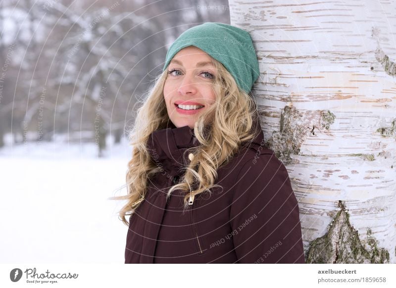 happy woman leaning against tree in winter Lifestyle Leisure and hobbies Vacation & Travel Winter Snow Winter vacation Human being Feminine Young woman