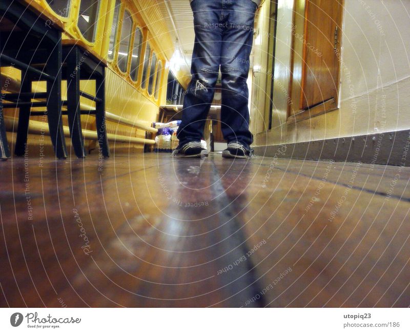 Worm's-eye view 2 Footwear Plank Reflection Watercraft Man Legs Jeans Hallway Chair Knock-kneed Corridor