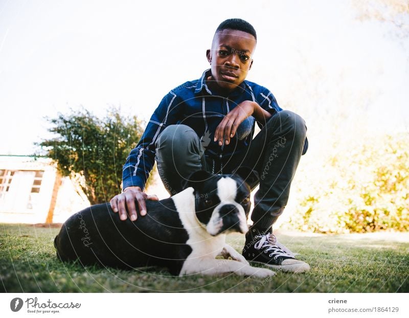 Portrait of male child with his dog on lawn Lifestyle Summer Garden Human being Boy (child) Infancy 8 - 13 years Child Grass Park Meadow Animal Pet Dog